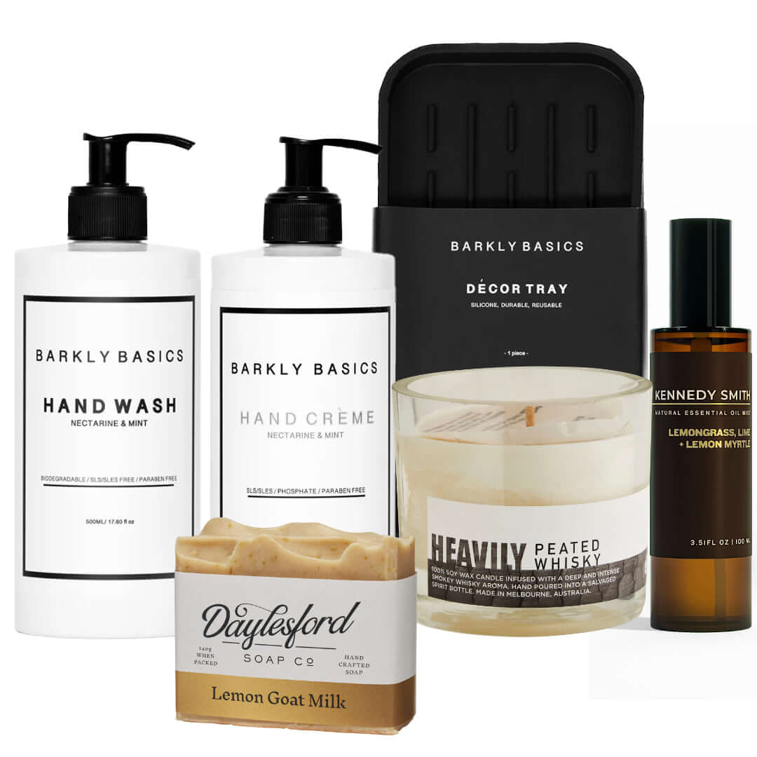 Gift box featuring hand wash, hand cream, candle, soap, and decor tray for thoughtful home luxury.
