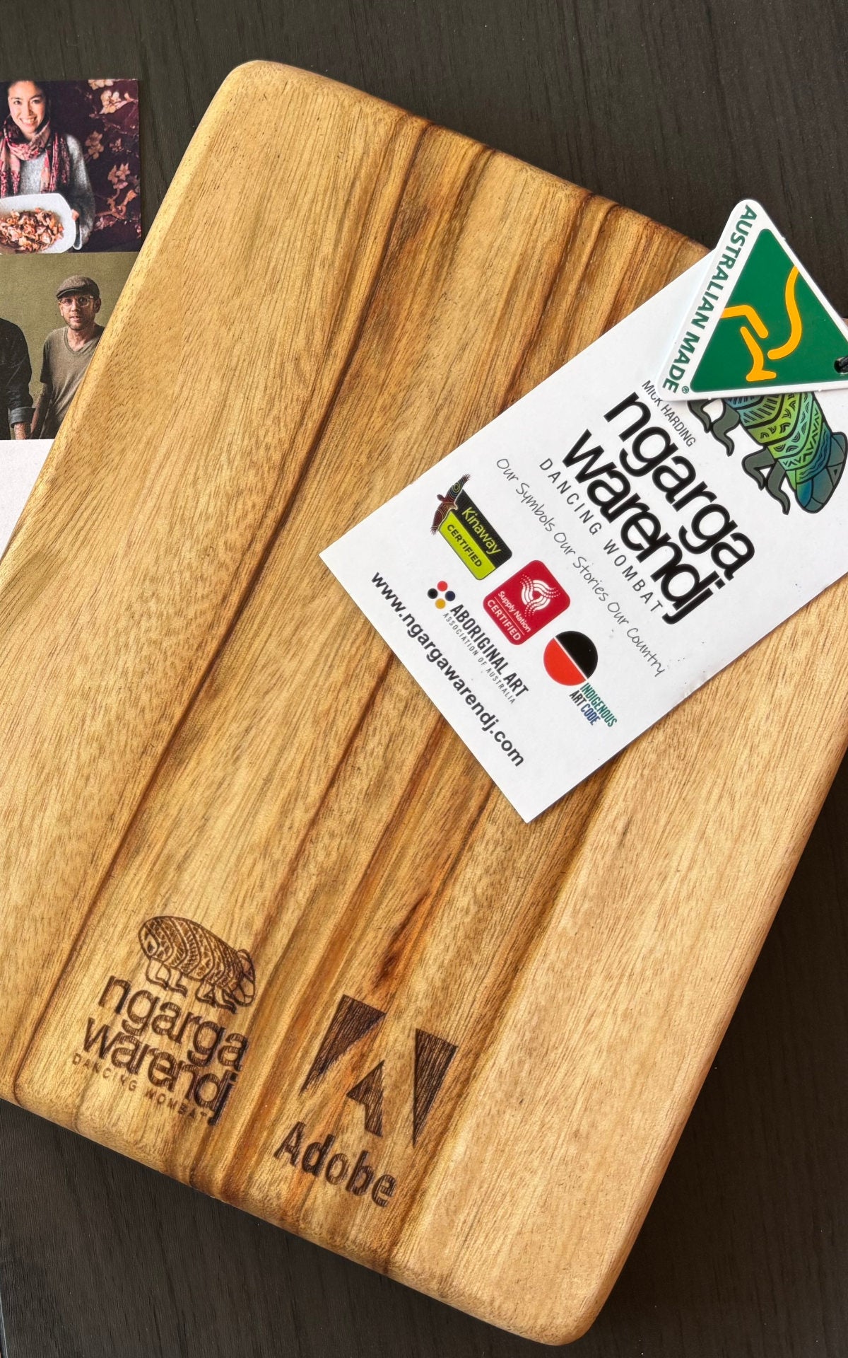 Aboriginal-owned Ngarga Warendj timber cheeseboard customised for Adobe, photographed alongside Madebox producer card.