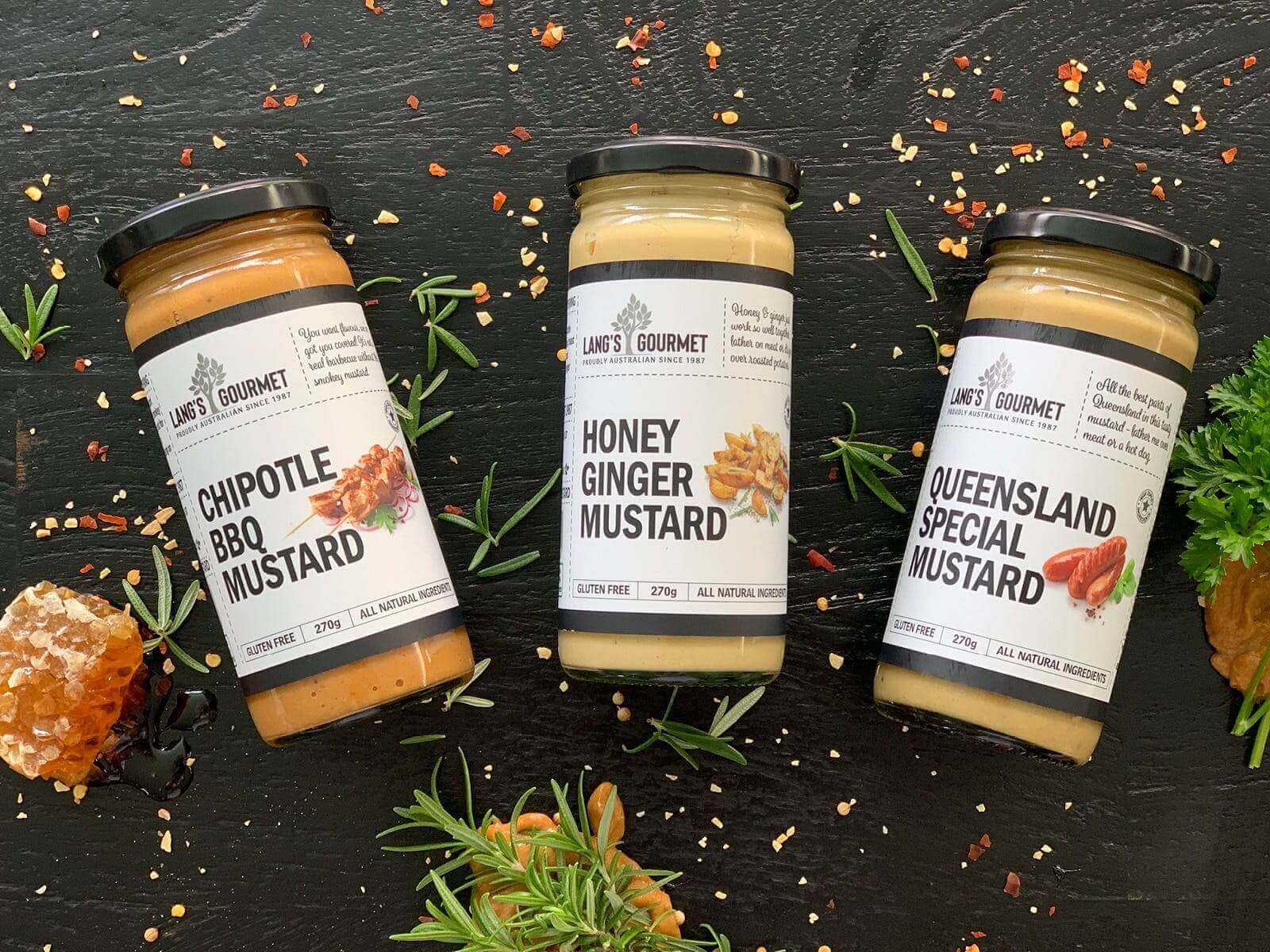 Mini Gourmet BBQ gift box featuring Chipotle BBQ, Honey Ginger, and Queensland Special mustard jars.