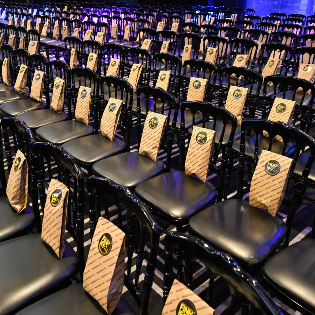 Madebox goodie bags arranged on seats for The Finney Awards event