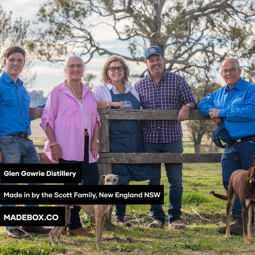 Glen Gowrie Distillery team from Scott Family in New England NSW, standing by a fence with dogs.