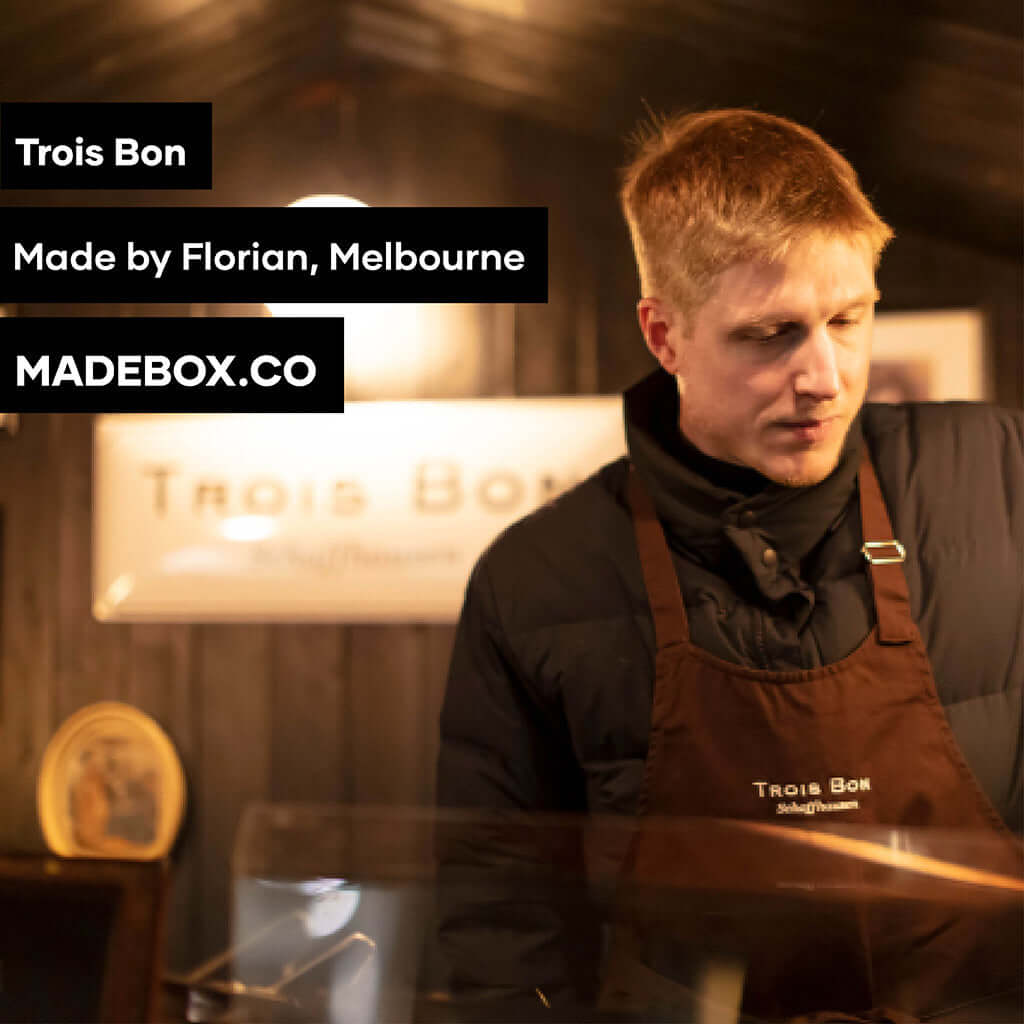 Florian preparing gourmet products at Trois Bon, a Melbourne-based artisanal shop, showcasing quality craftsmanship.