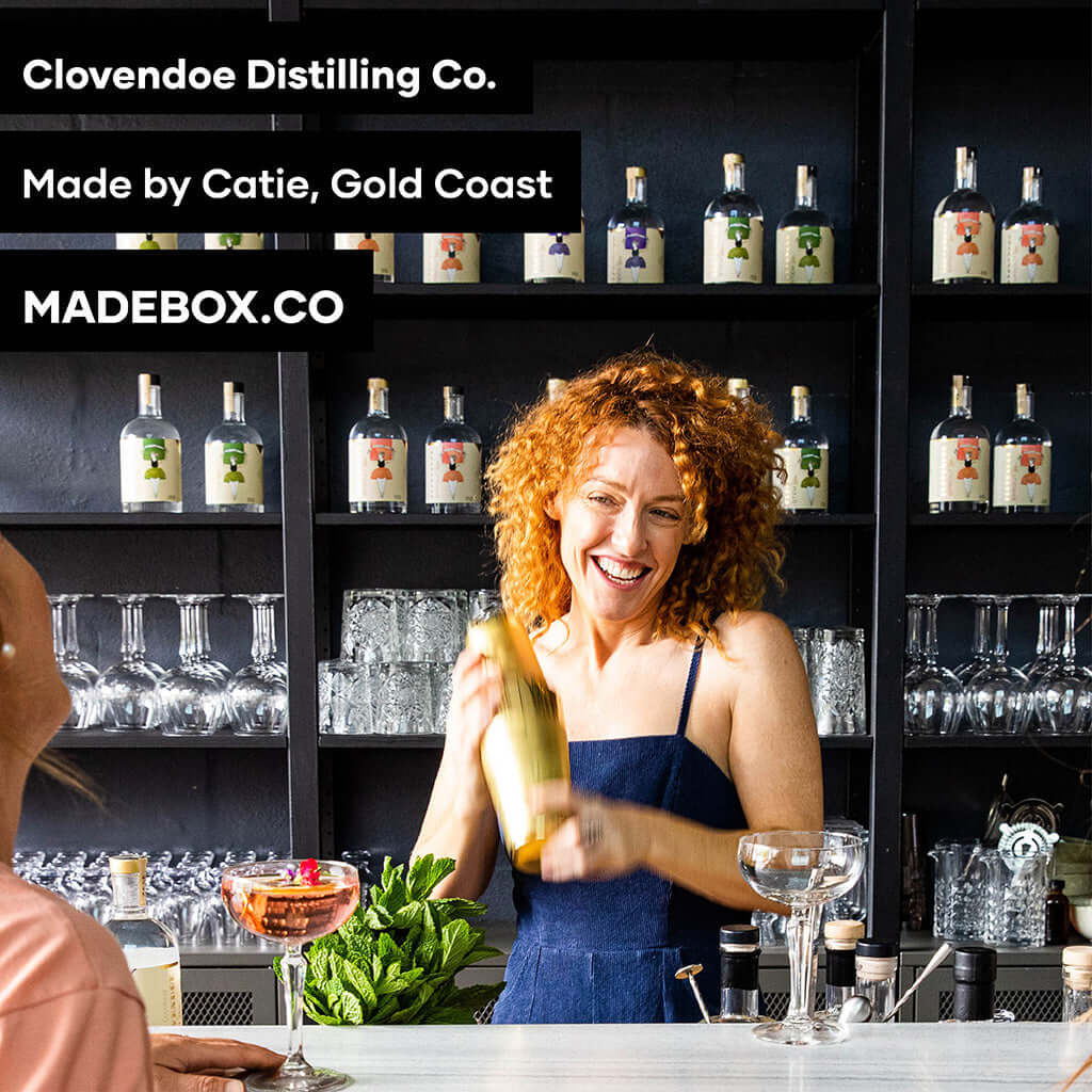 Catie from Clovendoe Distilling Co. shaking a cocktail with various bottles in the background, Gold Coast.