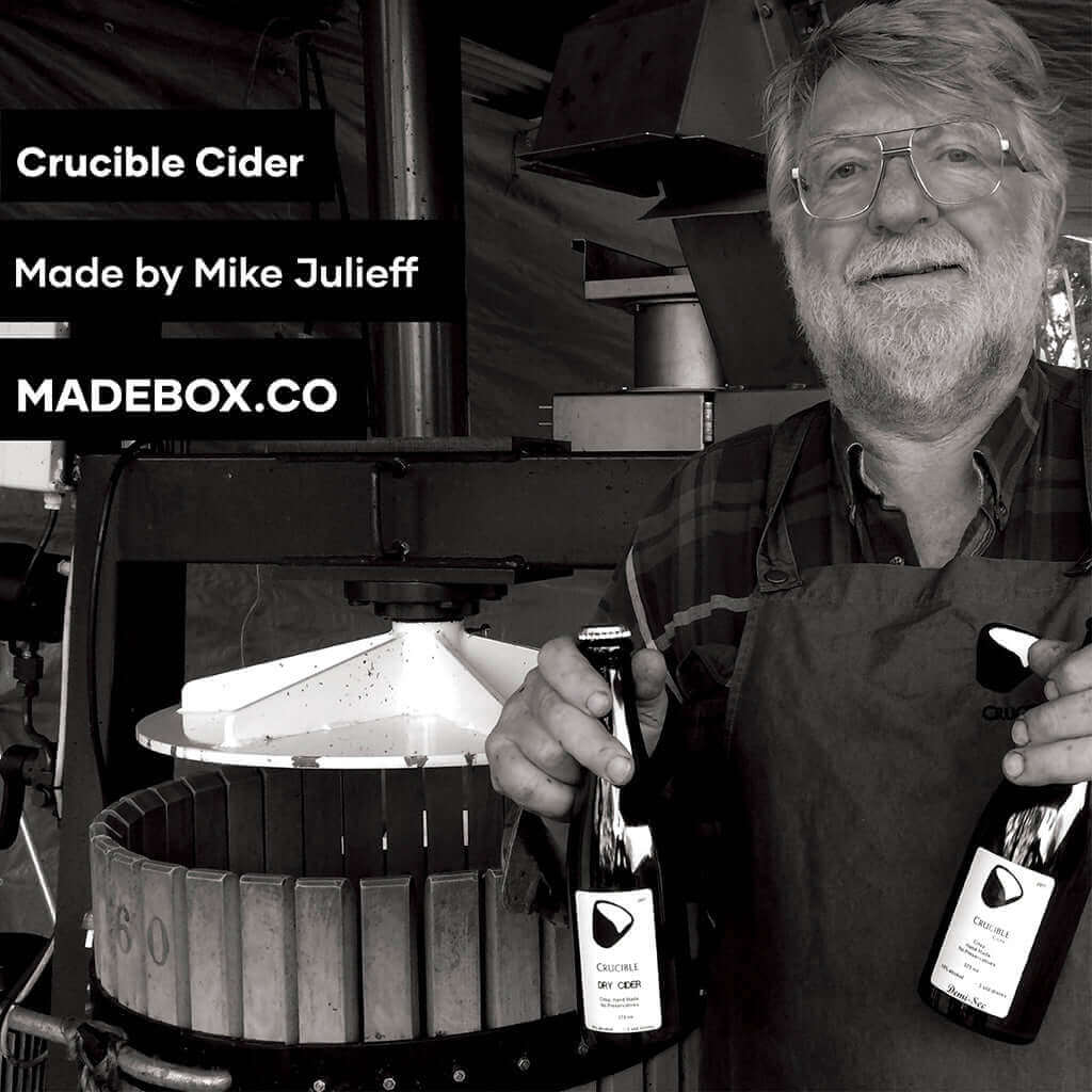 Mike Julieff holding bottles of Crucible Cider, crafted with care at Madebox.co.