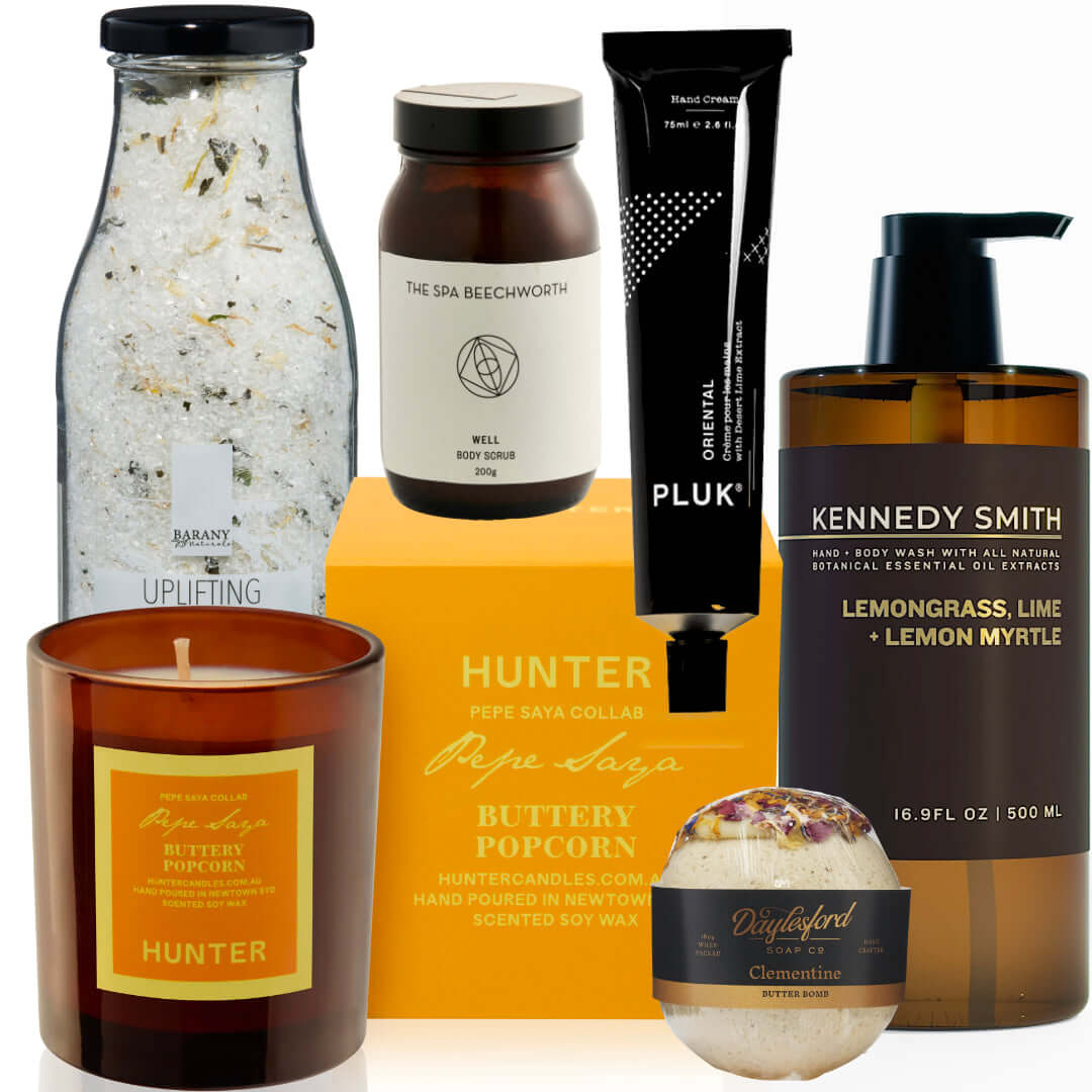 Indulgence Edit gift box featuring buttery popcorn, candles, skincare, and bath essentials for self-care relaxation.