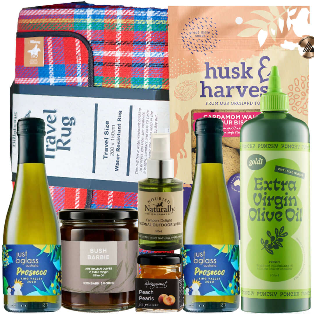 Picnic Box essentials including Prosecco, travel rug, and gourmet snacks for holiday gatherings.