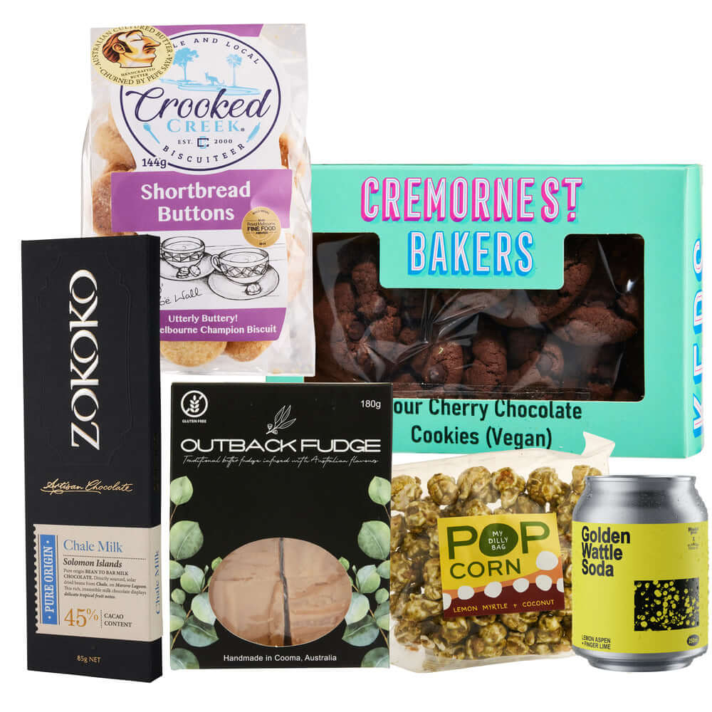Australian treat selection with shortbread, chocolates, cookies, and popcorn in a festive gift box.