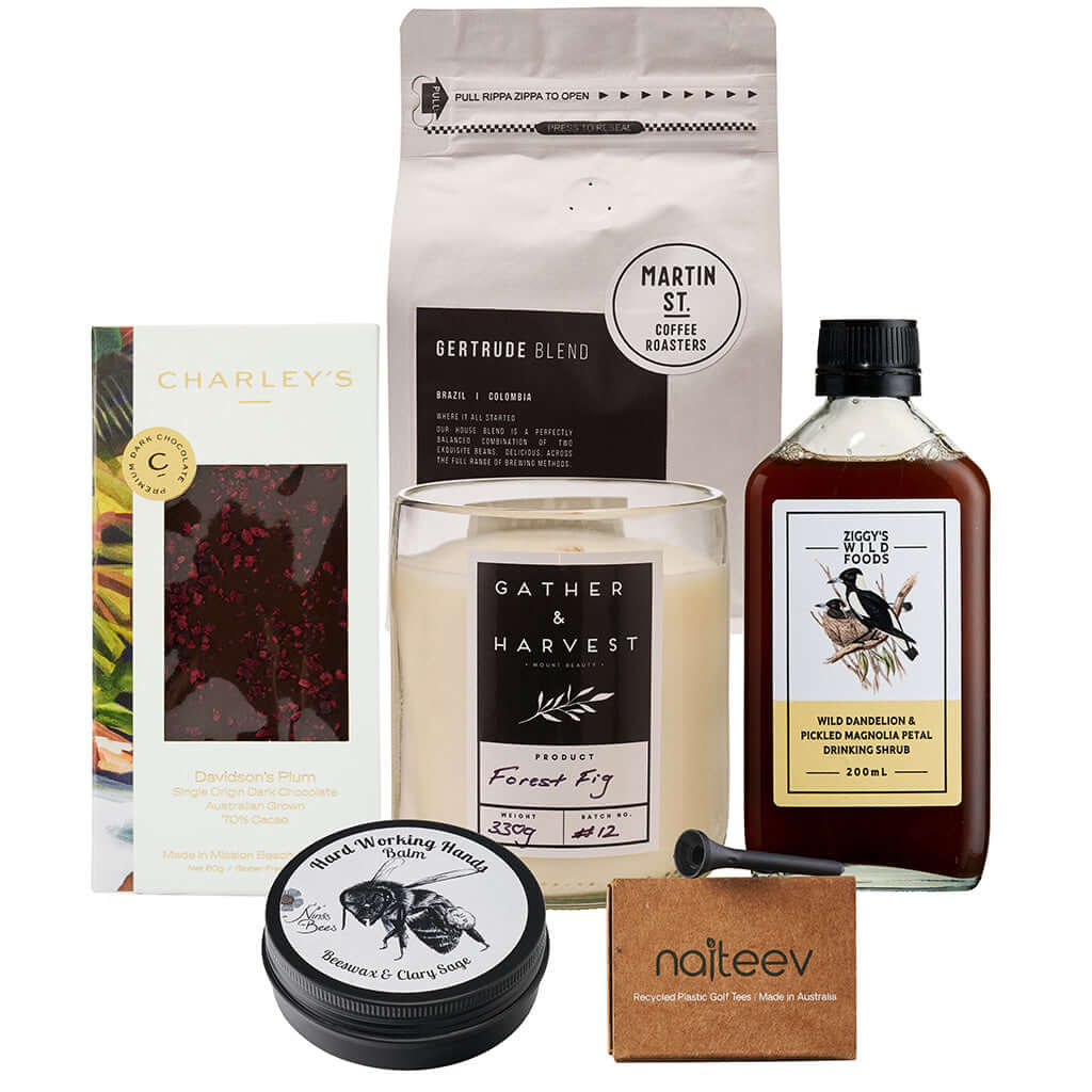 Sustainability Box featuring Charley's chocolate, herbal tea, candle, coffee, and natural products for eco-friendly gifting.